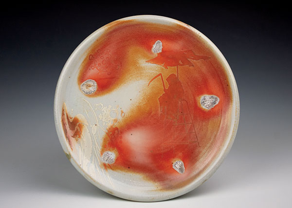 2 Denise Joyal’s Grim Coronas on the Beach, 8 in. (20 cm) in diameter, porcelain, underglaze, wood and soda fired, 2021.