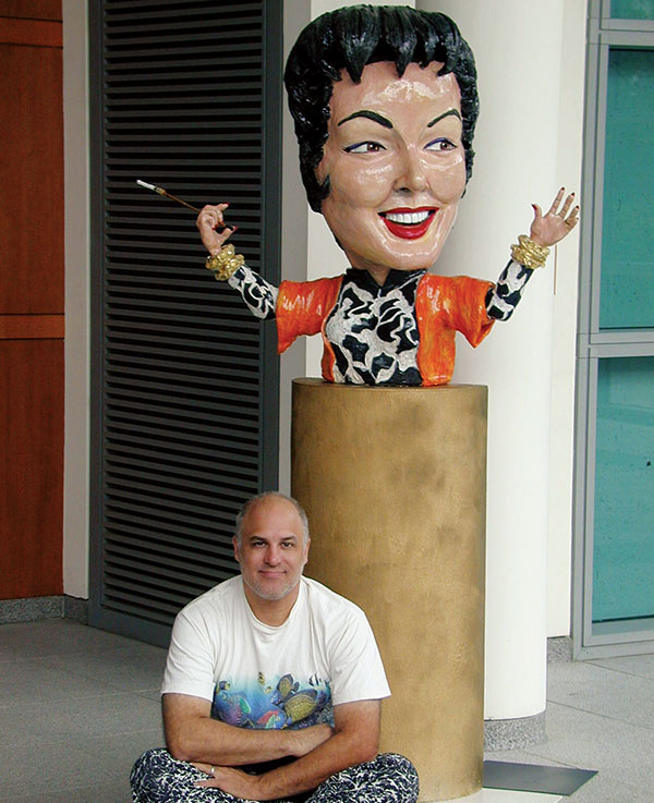 7 Auntie Mame (Portrait of Rosalind Russell), 4 ft. ( 1.2 m) in length, ceramic, 2001. Pictured with artist at the Oakland Museum of California’s Sculpture Court at City Center.