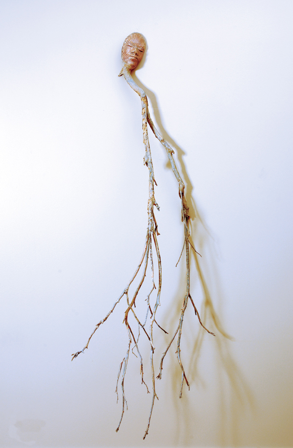 3 Earth Roots, 4 ft. 7 in. (1.4 m) in height, fired clay, terra sigillata, crepe myrtle tree branch, 2010. Photo: Owen Murphy. 