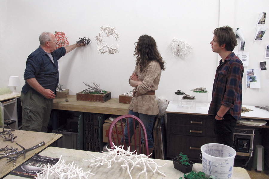 4 Students in the MN NICE program discuss work during a critique.