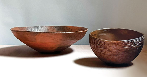 1 Elena Vasilantonaki’s smoke-fired bowls, white stoneware, terra sigillata made from local clay collected by the artist. She smoke fires her work in an above-ground brick chamber filled with sawdust and various other combustibles found near her family’s home on the island of Crete.