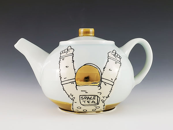 3 John Cohorst’s Tea Pot w/Astro, 91/2 in. (24 cm) in length, wheel-thrown porcelain, slip-trailed underglaze illustrations, fired to cone 10 in an electric kiln, gold luster, 2021. 