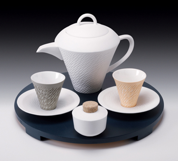 2 Sasha Wardell’s Shoal Coffee Set, to 13¾ in. (35 cm) in diameter, bone china, painted wooden tray. Photo: Mark Lawrence.
