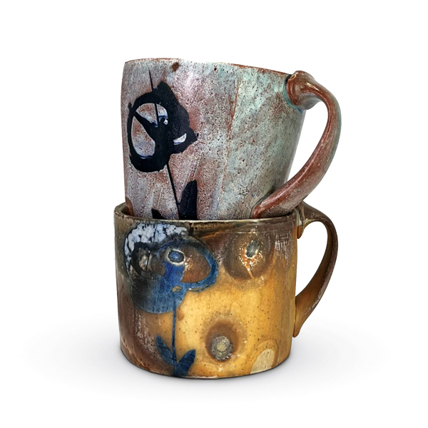 2 Sasha Barrett’s mugs, 5 in. (13 cm) in height, stoneware, glazes, wood fired to cone 10. 