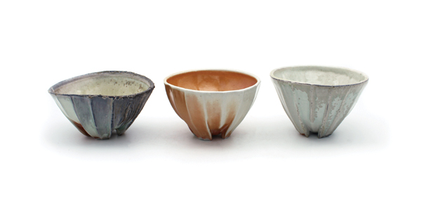 1 Elaine Olafson Henry’s bowls, to 6 in. (15 cm) in height; wood-fired porcelain; left to right: fired in South Carolina, Texas, Utah; 2018. Photo: Belger Arts. 
