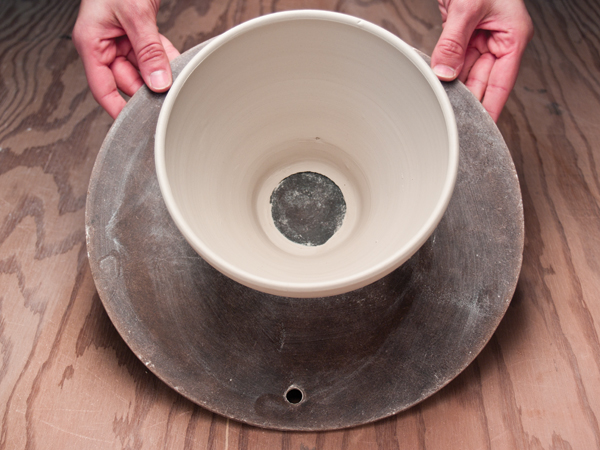 1 Throw a bottomless bowl on a bat, leaving the foot ring attached.