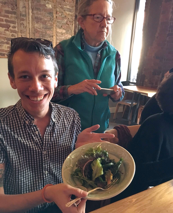 2 Artist and Food for Thought class instructor Arthur Halvorsen and a student pictured with a course plated by the restaurant staff in one of the student-made bowls.