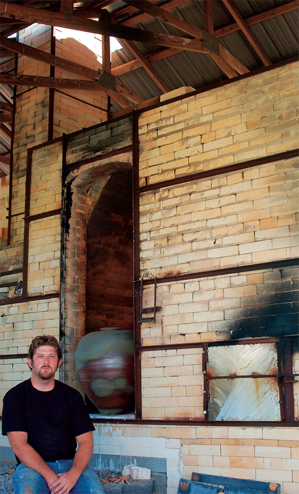 2 Matthew Gaddie with his wood-fired kiln.