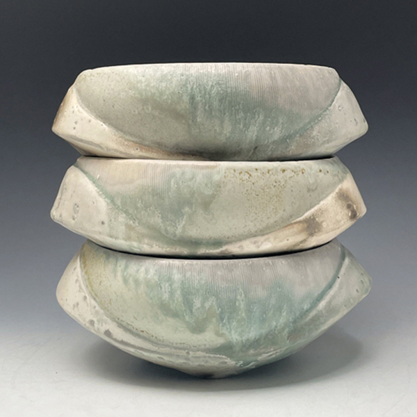 1 Brian Chen’s bowls, 8 in. (20 cm) in length (each), wood-fired porcelain.