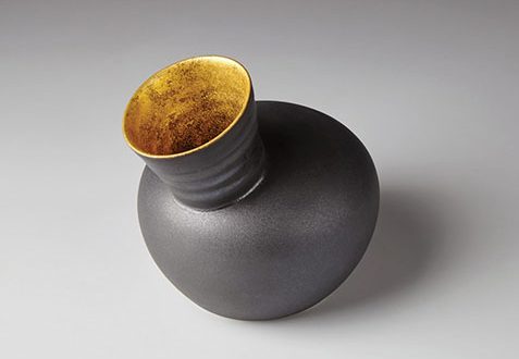 9 Gilded Speak Vase, 5 in. (13 cm) in height, porcelain, manganese glaze, 24-karat gold leaf, originally developed in 2015.