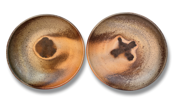 6 Suzanne Weil’s X and O Plates, 8½ in. (22 cm) in diameter (each), wood-fired stoneware, 2022.
