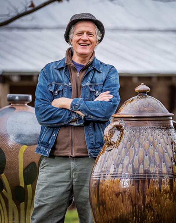 4 Mark Hewitt with a couple of his finished pots. 