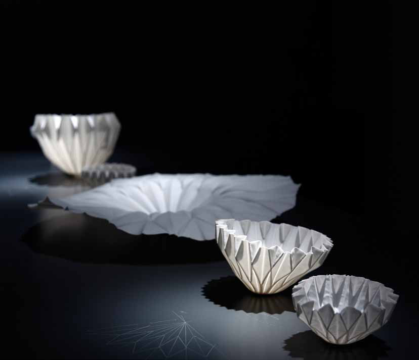 1 Hitomi Igarashi’s Making Porcelain with Origami, installation up to 19¾ in. (50 cm) in length, porcelain, slip-cast in papier-mâché molds, firing in an electric kiln, 2013. Installation photo: New Taipei City Yingge Ceramics Museum.