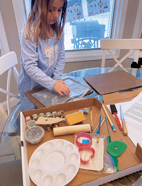 2 A young artist in the Renee family getting started in her home on the Garland Craft Takeout Kit. 