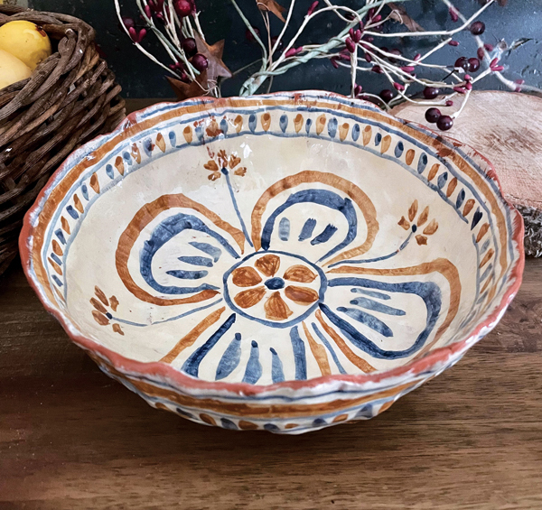 6 Bowl, 8 in. (20 cm) in diameter, pinched red clay, underglaze, clear glaze, fired to cone 05, 2022. 