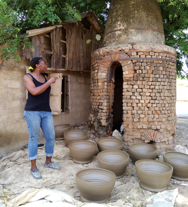 4 Orafidiya touring the remnants of a kiln in Vume that was built by pioneering potter Michael Cardew. 