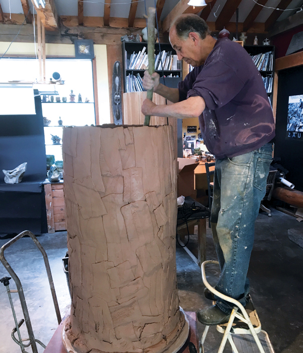 2 Jeff Shapiro in the studio forming a large slab vessel, 2019. 