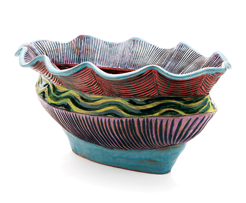 2 Jenny Lou Sherburne’s bowl, 12 in. (30 cm) in length, wheel-thrown and altered mid-range porcelain, glaze, terra sigillata, underglazes, fired to cone 6 in an electric kiln.