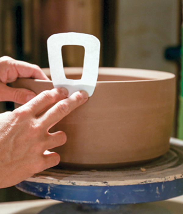 5 Hold a paper handle template up to the pot to determine the preferred shape.