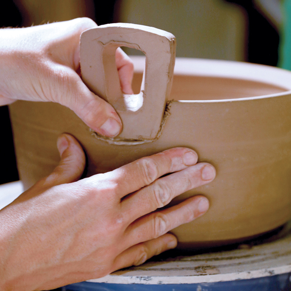 10 Gently press, while wiggling, the handle into the body of the pot.