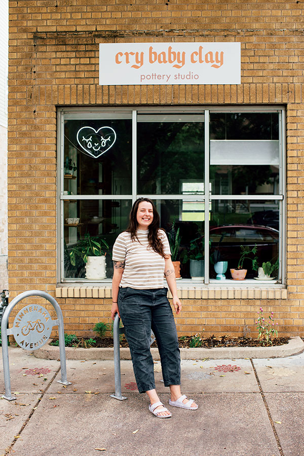 4 Cameron stands in front of the new storefront of Cry Baby Clay pottery studio one year after offering her first clay kit from her front porch. Photo: Zoe Prinds-Flash. 