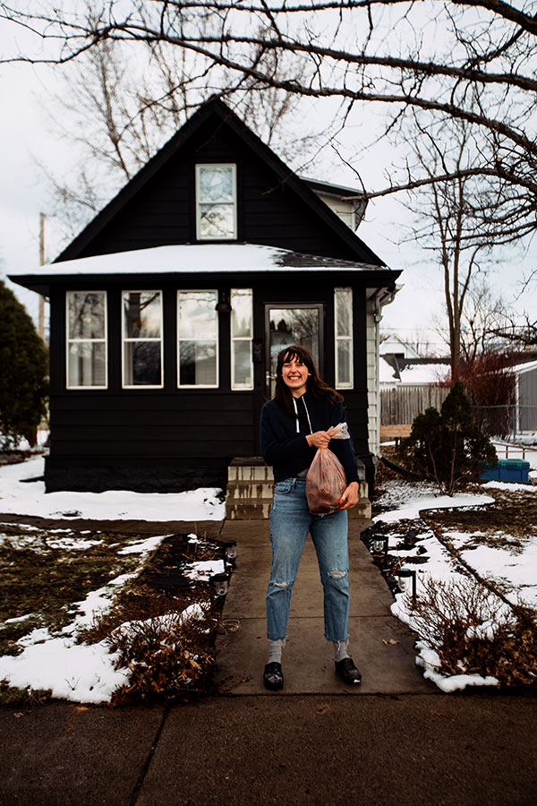 1 Katie Cameron stands in front of her porch, where she began making clay kits available for pickup in March 2020. 