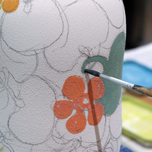 7 Use a small brush for the finer details such as a stem. Again, apply latex resist before painting another layer.