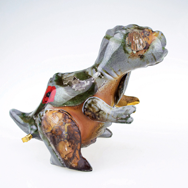 4 Brett Kern and Justin Rothshank’s dinosaur, 8 in. (20 cm) in height, slip-cast ceramic, underglaze, wood-fired for 95 hours, decal decorated and refired, gold luster, 2019–2020. 