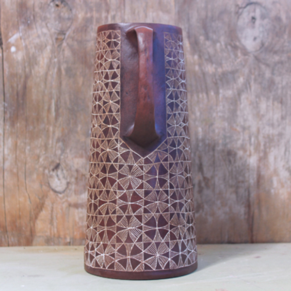 Red Kaleidoscope Pitcher, 8¾ in.(22 cm) in height, red stoneware, underglaze, wash, glaze, fired to cone 6 in oxidation, 2023. 