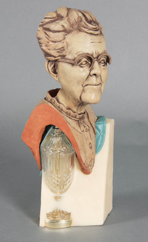 8 Kourtney Stone’s Great-Grandma Louetta the Steward, version 2, 22 in. (56 cm) in height, handbuilt earthenware, underglaze, fired to cone 04, living-room lamp, wax, place mat, scent of Lip Smackers and Caboodles melting in the back window of the family sedan, 2021. Photo: Coorain Devin.