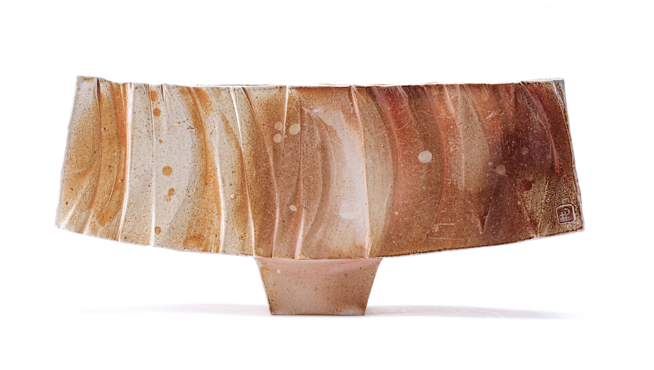 2 Layne Peters’ Horizontal Vase 2, 14 in. (36 cm) in width, handbuilt stoneware, wood and soda fired to cone 10, 2021.