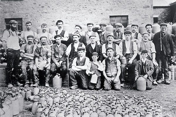 1 The workers of Waterside Pottery in 1906. Richard Bateson is in the front row with his hand covering his neck. Apparently he’d broken his top button and didn’t want his mum to see it in this Lancaster Guardian photograph. 