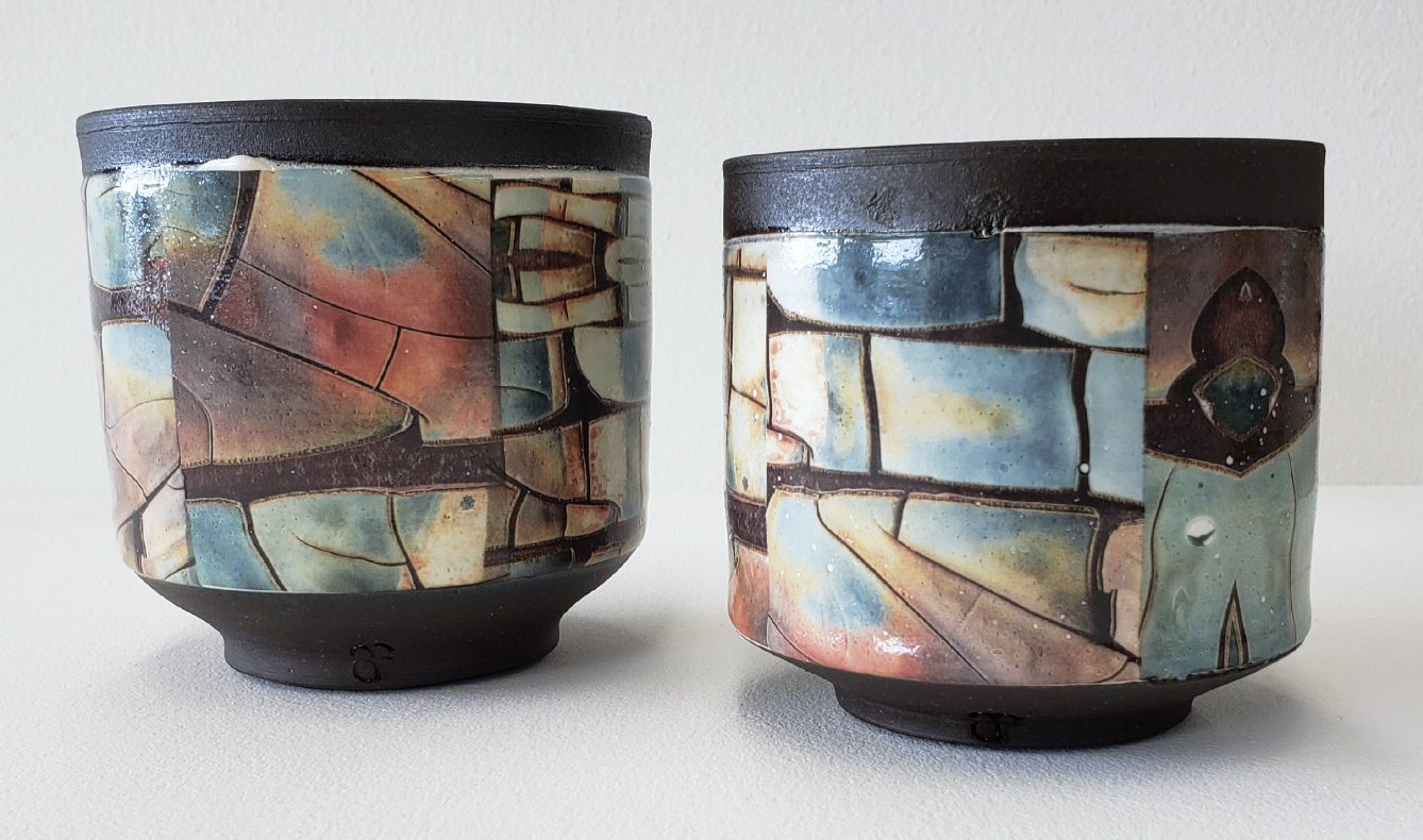 3 Dark brown cups, to 5 in. (12 cm) in height, stoneware, color waterslide decals, fired to cone 6 and then cone 013 in an electric kiln. 