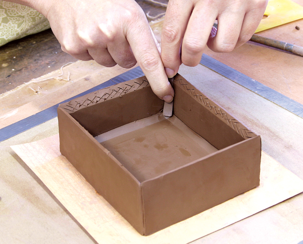 13 Attach all four sides to the bottom slab. The bevel cuttings fit snug into the corners of the pot and eliminate any need for rolled coils.