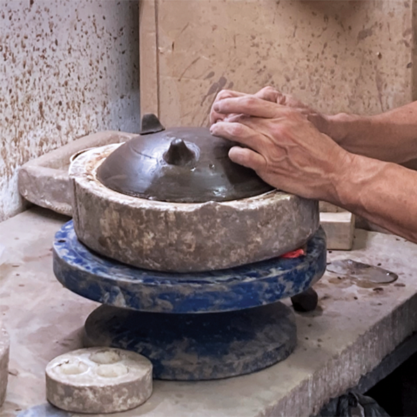 B Adding tripod feet to the churumbela (a disk-shaped Mexican spinning toy top) form. 