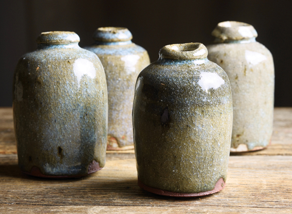 7 Celadon bud vases, 3 in. (8 cm) in height, foraged stoneware clay with feldspar/quartz sand/ash glaze, gas fired to cone 10, 2021. 