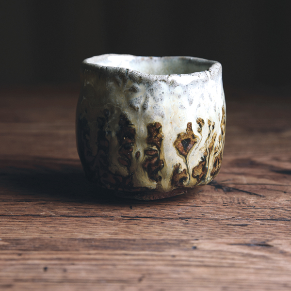 Pinched and stamped sake cup, 2 in. (5 cm) in height, wild stoneware, Chosen Karatsu-style ash glazes, reduction fired to cone 10, 2021.