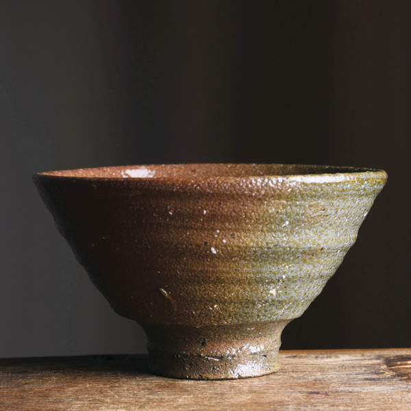 5 Footed bowl, 5 in. (13 cm) in diameter, iron-rich coastal clay body, wood/salt/soda fired to cone 3, reduction cooled, 2020. 