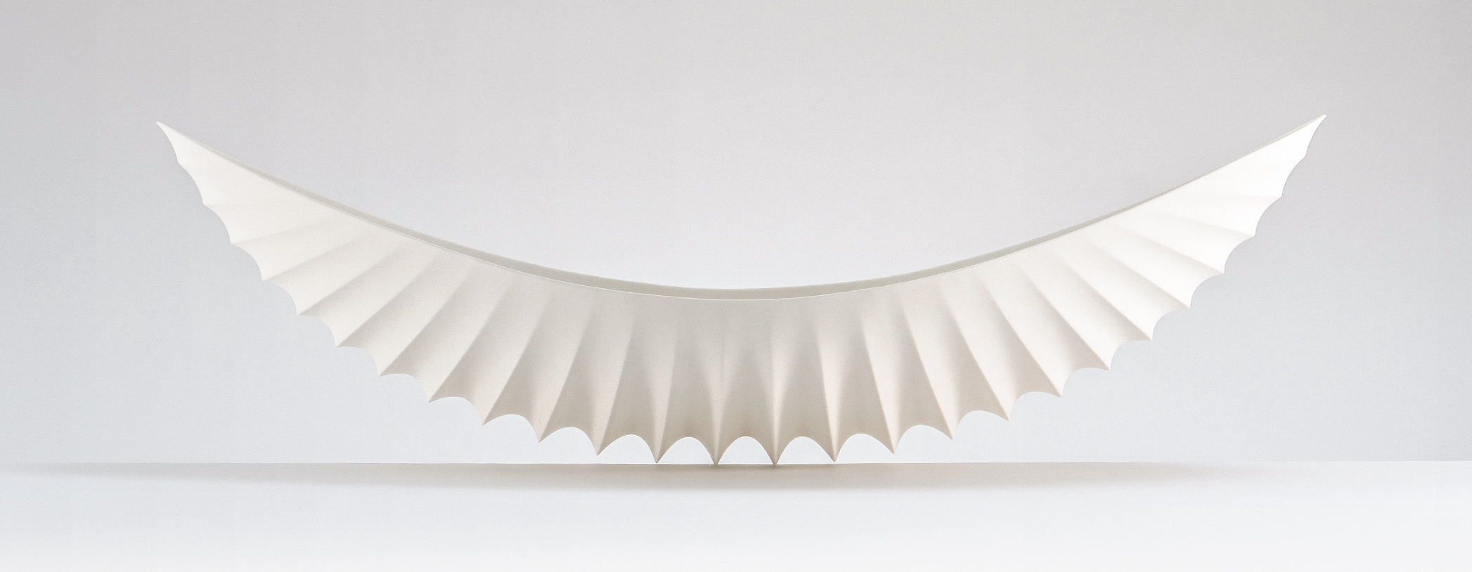 8 Mark Goudy’s Shell Series Object #1229, 19 in. (48 cm) in length, translucent porcelain, fired to cone 5 in oxidation, 2021.