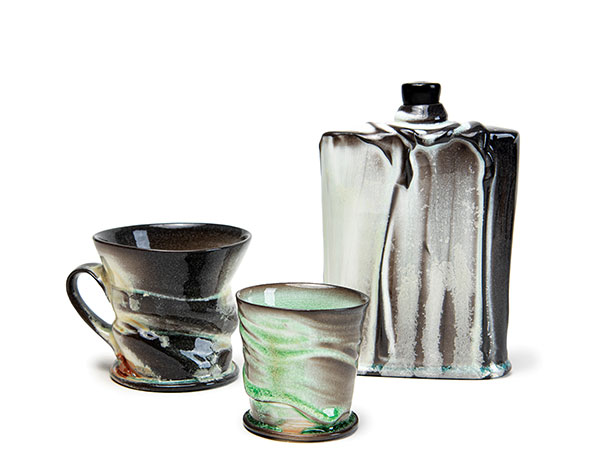 1 Matt Long’s mug, cup, and flask, to 7½ in. (19 cm) in height, porcelain, thick slip, flashing slips, carbon-trapping glaze, fired to cone 10 in a soda kiln. Photo: Silvia Palmer.