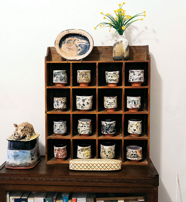 4 A collection of 16 Ron Meyers yunomis, accompanied by a Meyers vintage plate, lidded sculptural jar, and a Curtis Fontaine bottle. Of the cups, Middleton says, “I drink out of a different one every day.” All photos: Avery Brunkus.