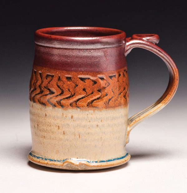 8 Eric Strader’s textured mug, 4 in. (10 cm) in height, stoneware, fired to cone 10 in reduction, 2015. Photo: Dick Lehman.