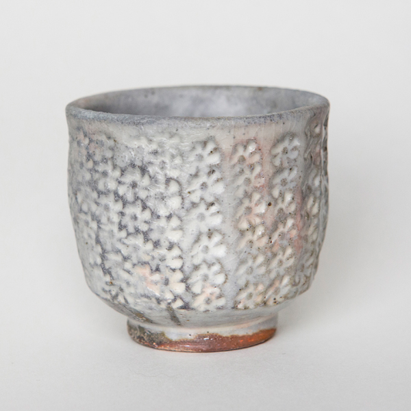 13 Peter Olsen’s cup, 3 in. (8 cm) in height, dark stoneware, white slip, clear glaze, wood fired to cone 10 and cooled in reduction, 2015. Photo: Brad Curran.