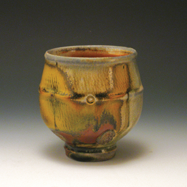 15 Tom Unzicker’s cup, 4 in. (10 cm) in height, white stoneware, tenmoku glaze, wood fired to cone 12, 2015.