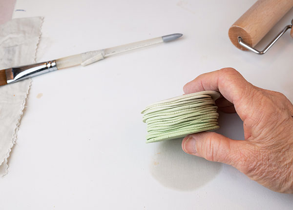 6 Stack the disks in order, sticking them together with a small amount of water. 