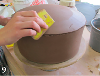 Turn the leather-hard bowl upside down and clean up the bottom using a medium soft rib.