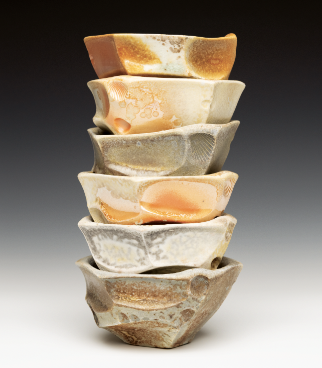 Wood-fired bowls, 3¾ in. (9.5 cm) in diameter each, porcelain, shino liner glaze, wood-fired to cone 10 in reduction, 2021.