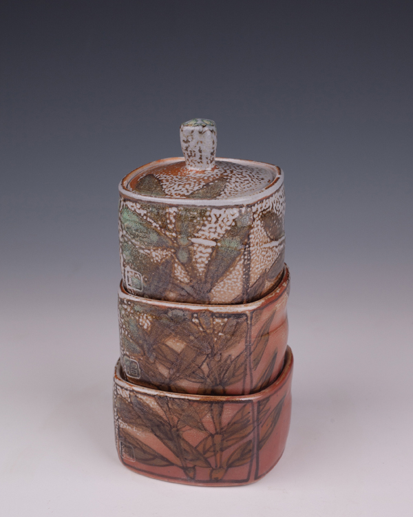 A four-piece arbutus leaf stacking spice-jar set, wheel thrown and altered, fired to 2374°F (1300°C) in a salt kiln.