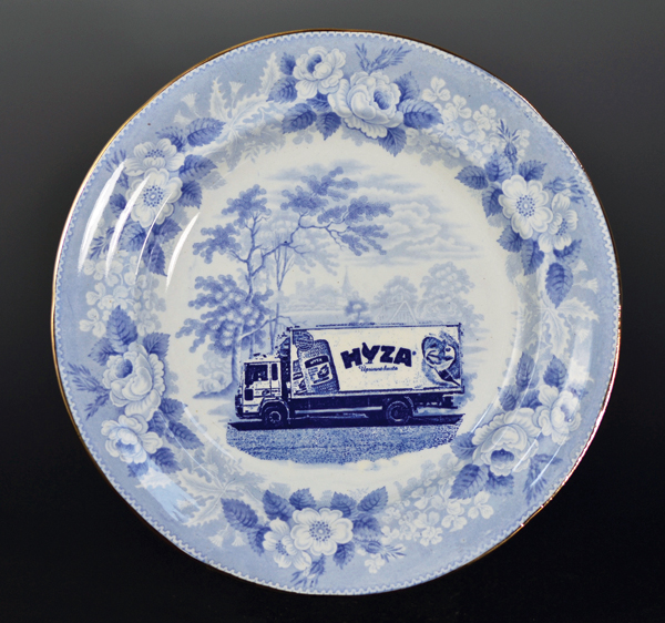 1 Paul Scott’s Cumbrian Blue(s) Refugee Series No.1, in-glaze decal collage on partially erased transferware plate by unknown maker, 2016. Copyright Paul Scott. 