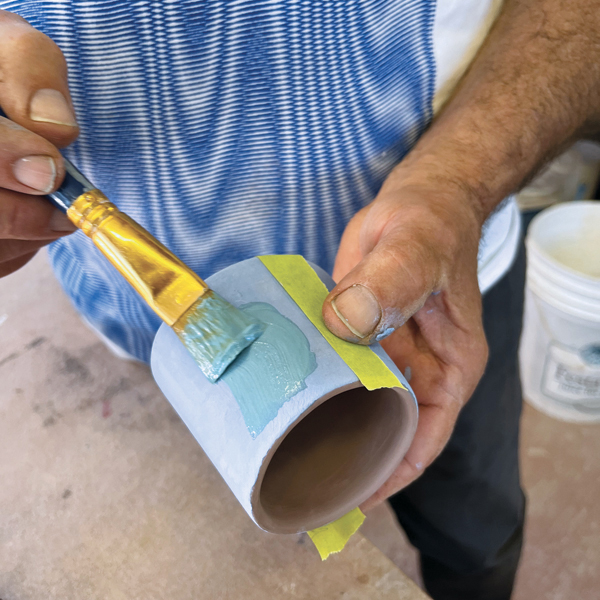 6 Apply a layer of blue underglaze then turquoise, followed by other colors.